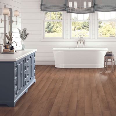 luxury vinyl plank floors in a rustic bathroom